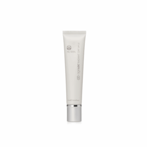 A tube of Transformation Radiant Day Cream displayed on a white backdrop.