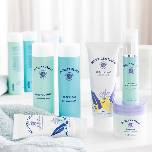 Nutricentials family product line up display on a bathroom countertop.